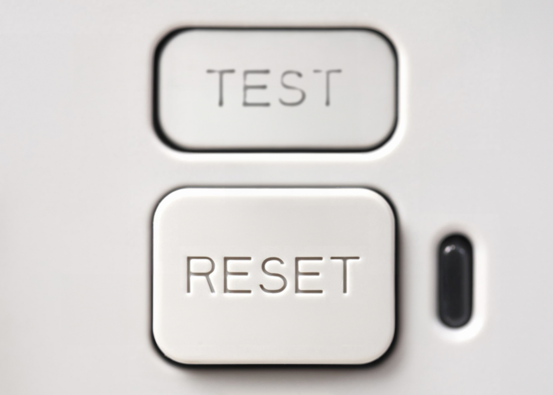 Reset and Test buttons on a GFCI electrical outlet.